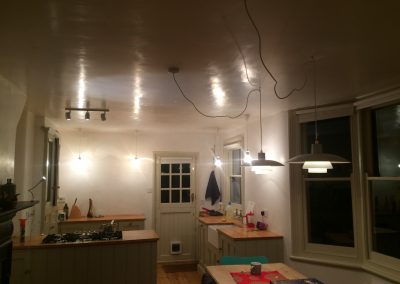 Hanging lights above a dining area Brockely