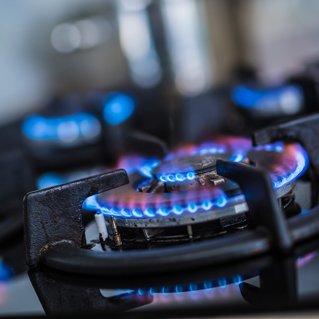 Gas flames from a gas cooker hob needing a Gas Safety Certificate